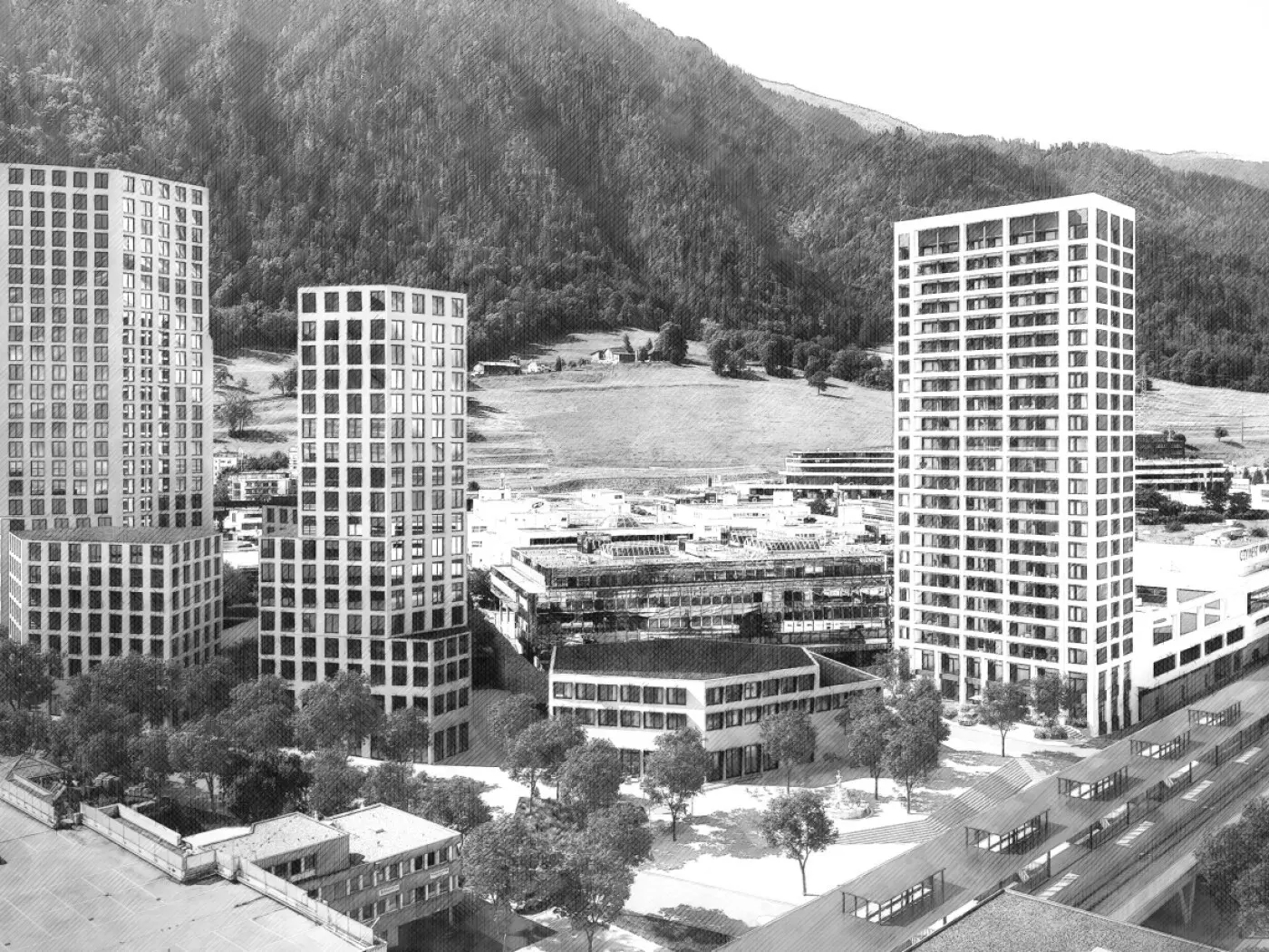 Vista di un complesso residenziale moderno con torri alte e edifici bassi, circondato da aree verdi e montagne sullo sfondo. Il design è caratterizzato da facciate in vetro e geometrie diverse, con spazi aperti e alberi lungo le strade.