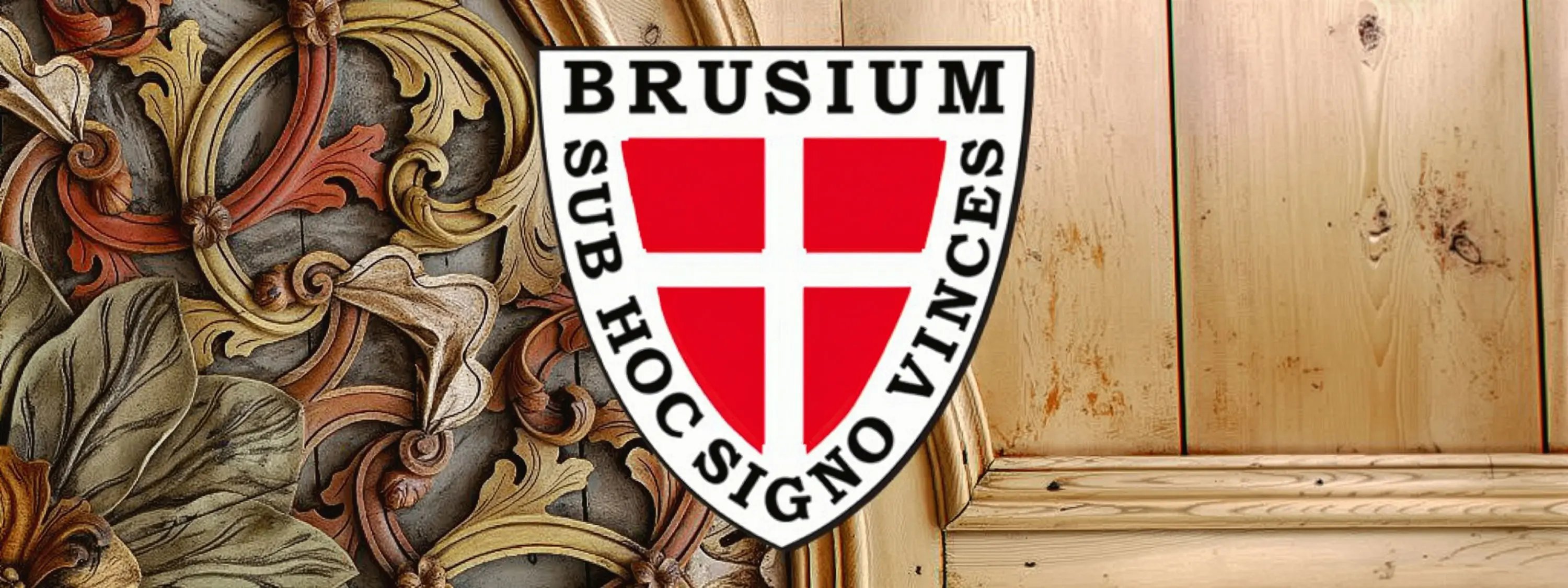 Scudo con la scritta "Brusium" e il motto "Sub hoc signo vinces" su uno sfondo decorato e una superficie in legno.
